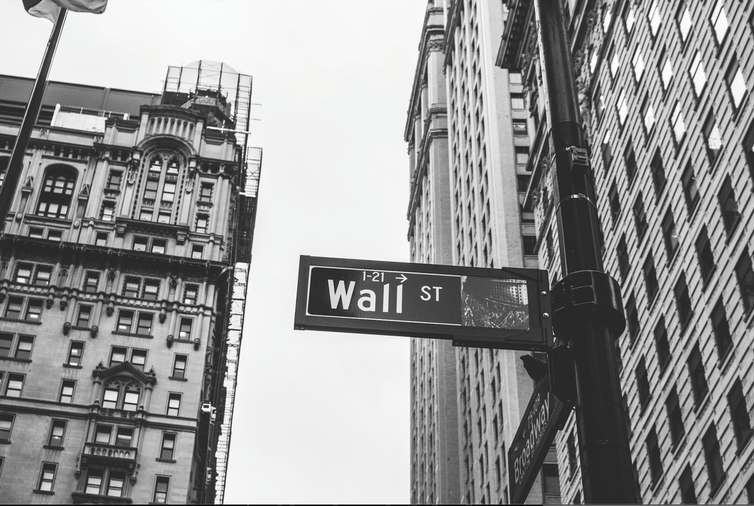 Wall Street sign to denote the importance of market health as a factor for small business success